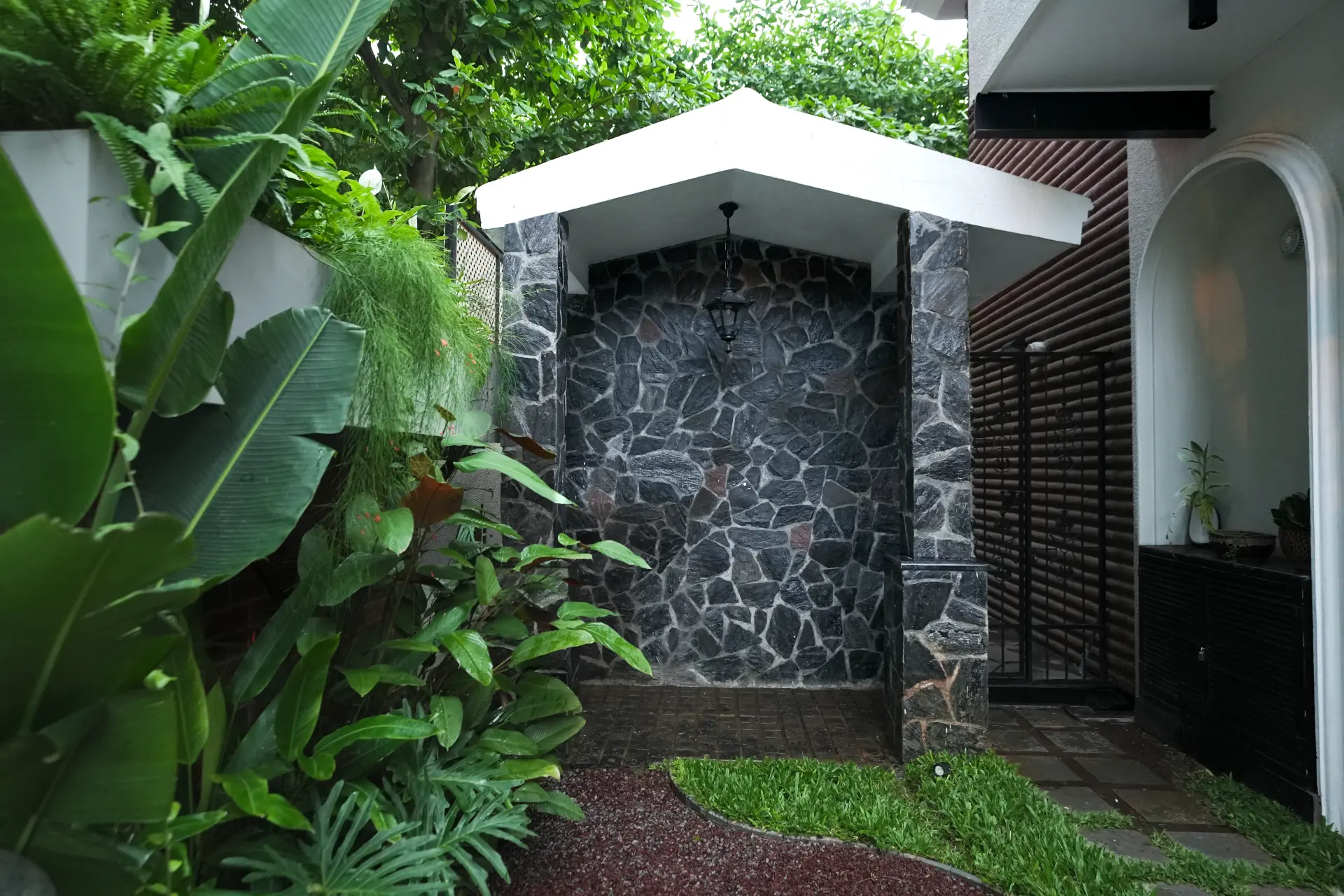 Stone-clad porch and gravel walk