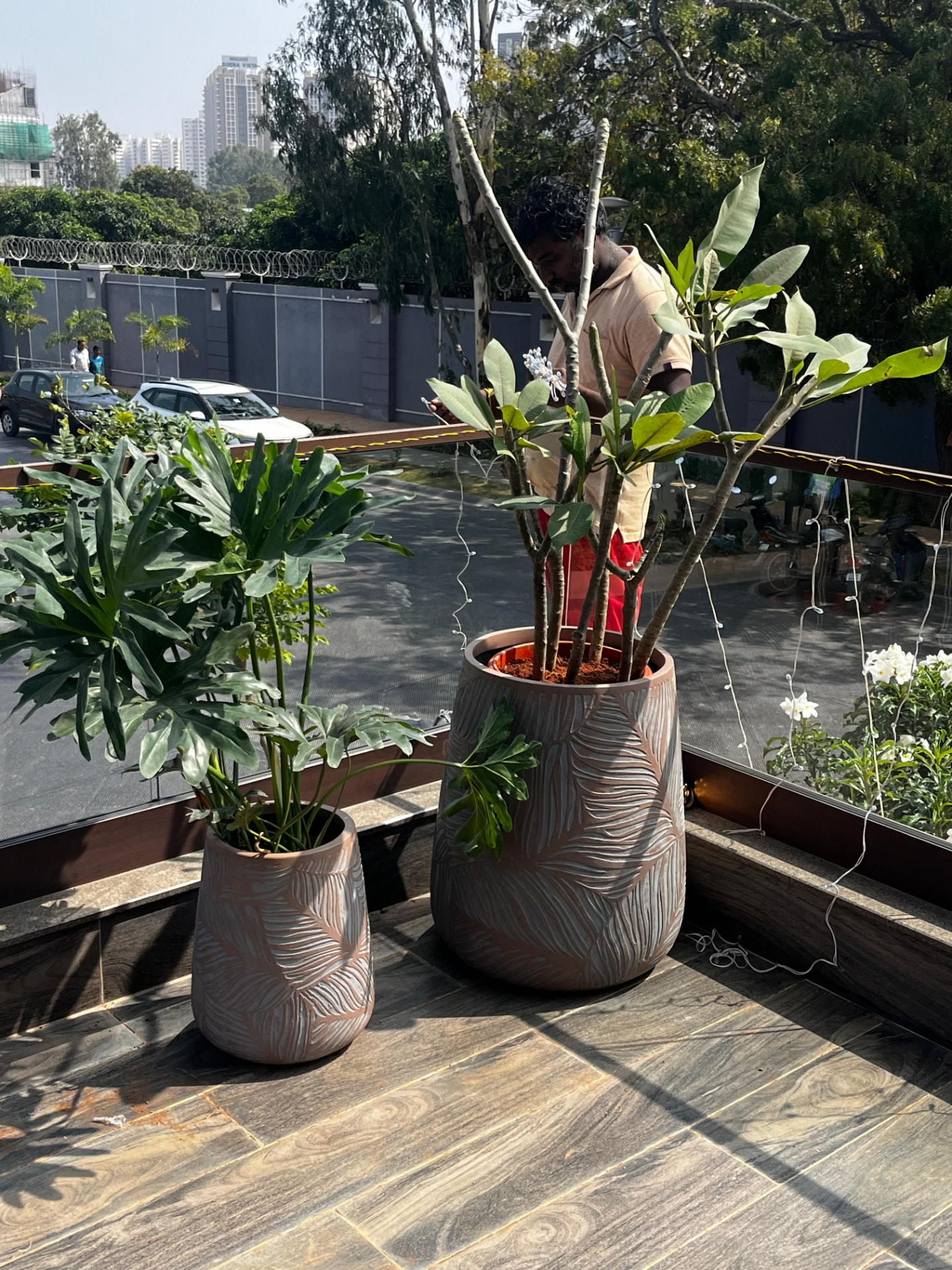 Carved terracotta pots at the glazed edge